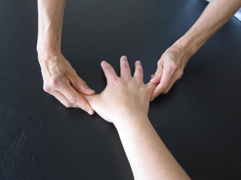 Stretching With the hand supported on a pillow, gently