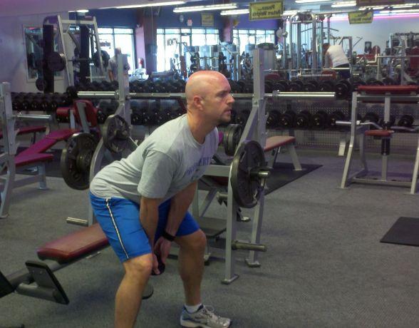 Workout A KB/DB Swings Stand with your feet wider than shoulder-width apart.