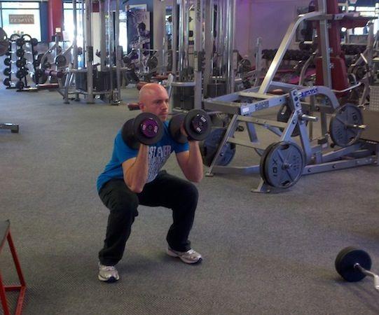 Workout C DB Squat and Press Hold a pair of dumbbells