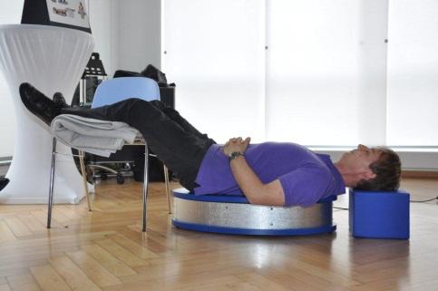 Photo 23: In the back position of the OSFLOW you will relax your whole back. You should rest your head at a convenient height on a pillow or the cube that can be purchased with the OSFLOW.