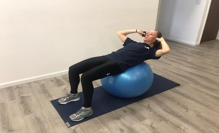 Ball Crunch with Hand Weights (seated slightly down from the top of the ball) Sit on top of the ball and slowly lay back until the ball is in the arch of your lower back.