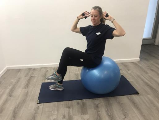 Cross Crunch on Ball (with weights) Perform standard crunch, with weights when ready, but add a slow rotation at
