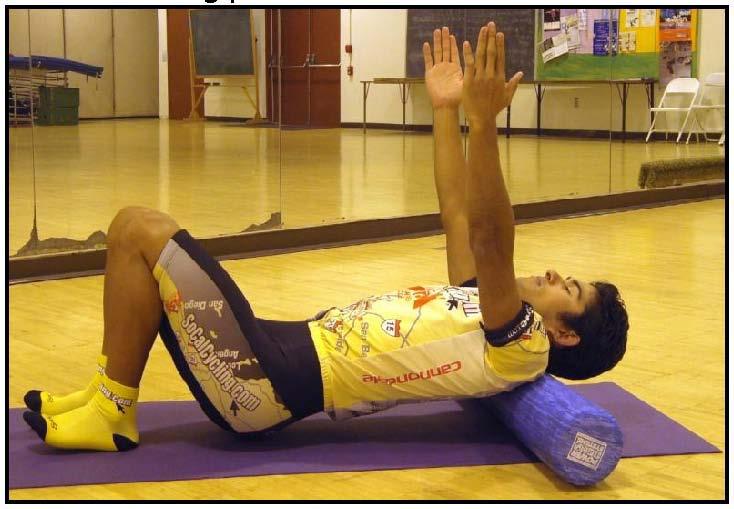 Roll from mid to upper back, side to side to emphasize a stretch in the spine and