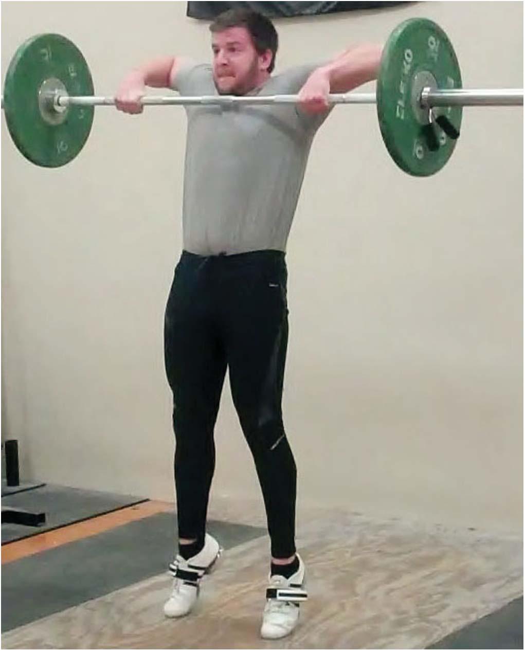 Figure 3. Finish of the barbell elevation phase and triple extension for the hang high pull. power.