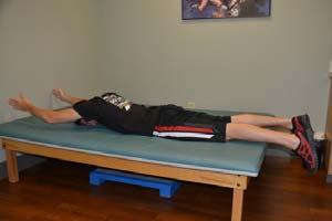 Lower the head and shoulders. Do not tense your shoulder muscles. Exercise 13: Arm Lifts Starting Position: Lie on your stomach on a mat.