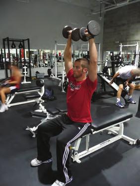 SHOULDER PRESS While sitting up tall, weights next
