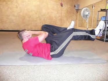 Crunch forward using your abs while trying to bring your elbows toward your knees.