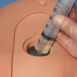 Using the 60ml syringe provided, remove as much water as possible.