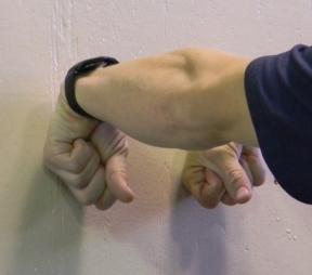 position with the knuckles facing down.