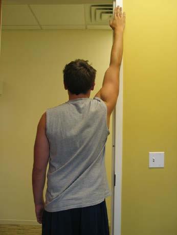 Place your hand on the wall and lean slightly