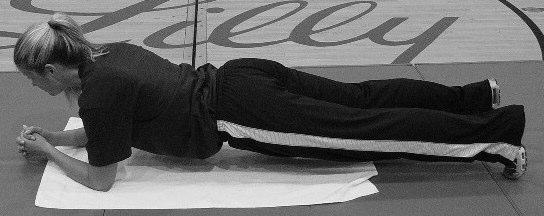 Lie supine on floor with legs bent. Push lower back to floor.
