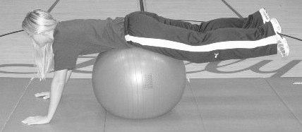 Using the abdominal muscles, crunch up, lifting chest and shoulders up with the