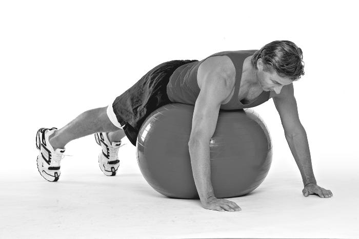 Chapter 8: Walking Tall: Chest, Abdominals, and Lower Back 117 Figure 8-5: Prone position on the ball. Stay in this position for a few minutes, extending and relaxing.
