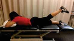 Contract glut muscles to then lift leg from the surface while keeping point of hip in contact with the table.