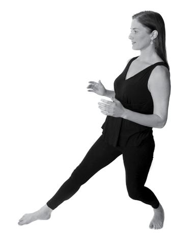 Stand with your feet hipswidth apart and slightly bend your knees. Shift your body weight into your right leg and turn your left foot out to a 45-degree angle.