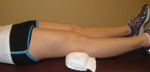 QUADRICEPS STRENGTHENING - Lying on back with towel roll under surgical knee - Push
