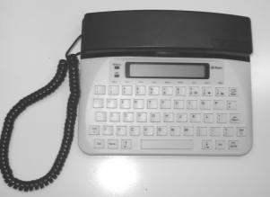 A hearing person answering a shared line (voice and TTY), hearing nothing or a series of beeps, places the phone on the TTY coupler (on non-direct connect TTYs) or turns on the TTY (on direct connect