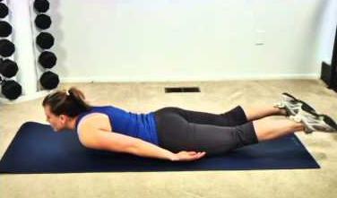 Lie back into the supine position on a comfortable surface with your knees bent upward, feet together and flat on the floor. Hands can be placed either down by your sides or up on your midsection.