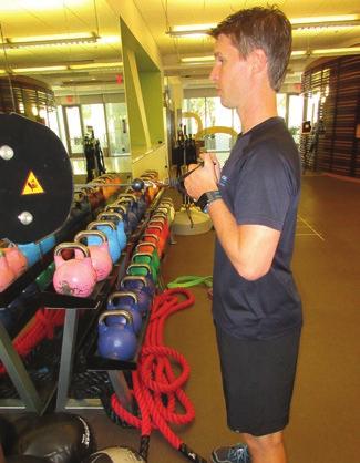 Cable Face Pulls Coaching Tip: Pull the weight directly towards your face, separating your