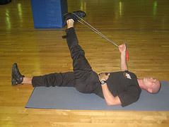 Belt hamstring stretch: Find a belt or rope, lie on your back and strap the belt around your left foot.