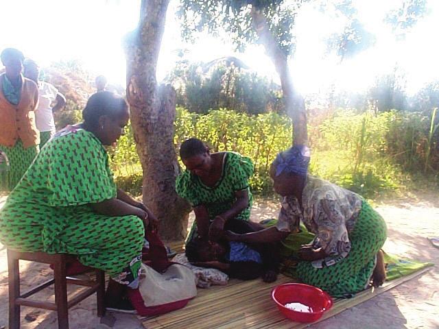 Care and Support Home-based care volunteers with client in Zambia Health Systems Strengthening Maternal and Child Health