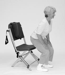 Maintain neutral spine as you lean forward to lift your bottom off the chair into a squat position. Hold squat 5 to 10 seconds. () 3.