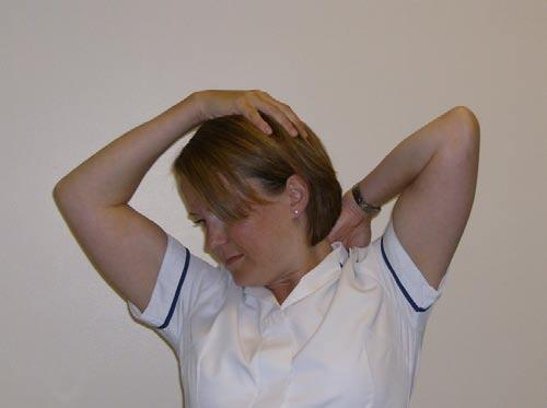 Using your left hand, slowly tilt your head towards your right shoulder; hold this position whilst turning your head slightly, looking down towards your left armpit.