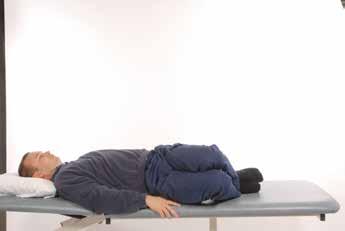 2. Knee rolling Lie on your back with knees bent. Slowly roll your knees from side to side keeping your upper trunk still. Repeat times 3.