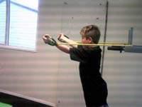 Triceps Extensions Attach the resistance band to a door-frame. Stand 3 feet away from the door-frame facing away from it. Hold the handles in underhand grip with your arms in front of your face.
