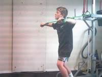 Keeping your arms lock in a slightly bent position, move from the shoulder joint to bring the handles together at your