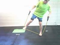 Place the resistance band under your feet and hold the handles with a double-handed grip in front of you.