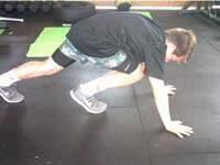Mountain Climbers Starting in the plank position (extended arms on the floor, shoulder width apart, body flat,