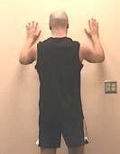 3 Wall slide stretch Stand facing a wall; place the hands of both arms on the wall. Slide the hands and arms upward.