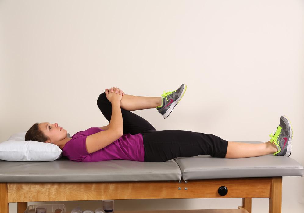 15 Iliopsoas stretch Lie on your back for this exercise.