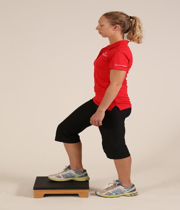 Slightly bend the surgery knee so that your heel comes off the ground. Place your hands on your hips to keep them level for this exercise.