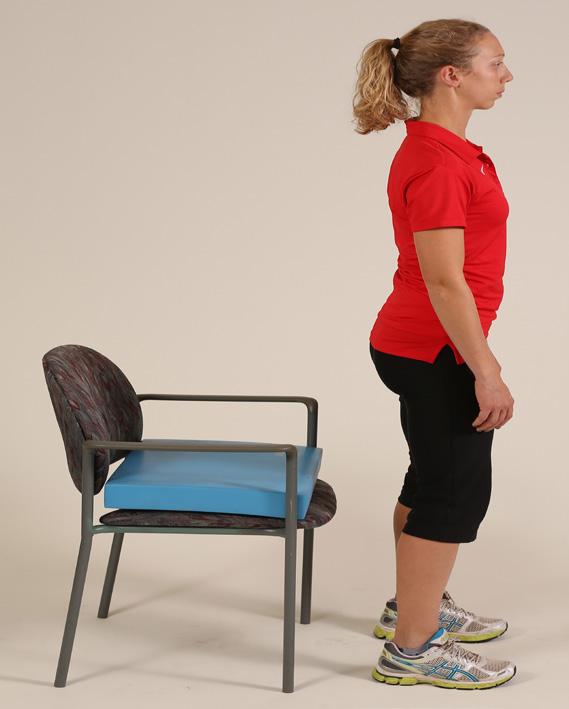 Then stand and return to the start position. Keep your knees over your ankles when doing squats.