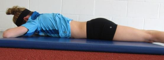 Prone Core Activation Lay face down on a mat. Place hands palms down under forehead to support head. Inhale deeply into the abdomen and expand through the belly.