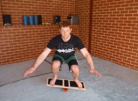 Balance Board Squat Holds Stand on a balance board and then squat down and hold for 5 seconds, making sure your maintain good posture with your chest up.