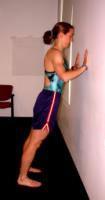 Allow your chest to move towards the wall, as you would into a normal push up position. Once you are in the down position push away from the wall.