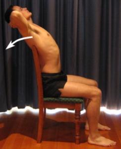 Figure 9 - Chin Tucks Extension over Chair Begin sitting tall on an appropriate chair (the top of the back rest should end at the level of your mid back).
