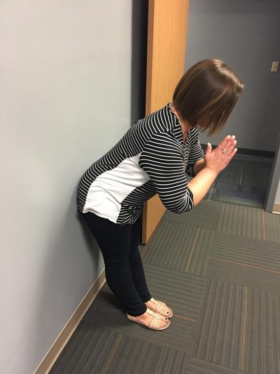 Dippy Bird Measure one foot length out from the wall, keeping your feet together. Put your hands in front of you in a "praying" position.