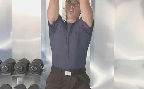towards the middle of your chest. Squat down and back, keeping the knees behind your toes.
