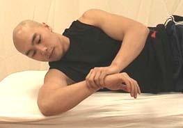 Sidelying internal rotation stretch Lie on your side with