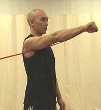 Taking the cord in the hand, move the hand toward the chest as far as it feels comfortable. Return to the start position.