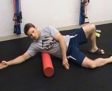 Raise your hips off the ground and roll from your upper to mid back, pausing when needed.