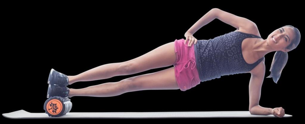 SIDE PLANKS Place your feet on the foam roller and assume a side plank position. This movement targets your obliques, toning your sides.