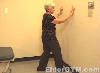 Calf Stretch (Click for video demonstration) 78 Stand facing a wall. Place your hands on the wall. Step forward with your right foot.