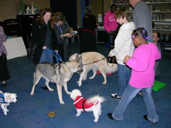 People Animals Love (PAL) Therapy Dogs and children enjoy interacting