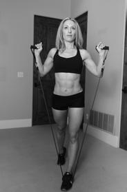 ) Position the resistance band underneath the front foot, holding either end in your hands, placed up at