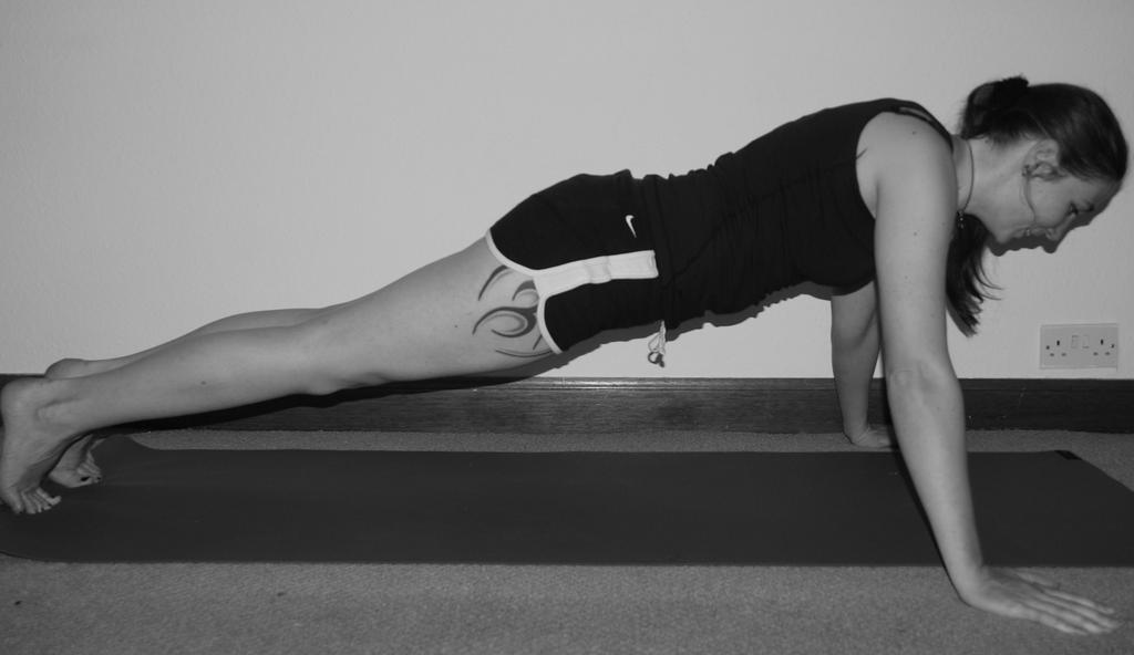 Bend the elbows outwards to lower the chest towards the floor. Push back up to the starting position.